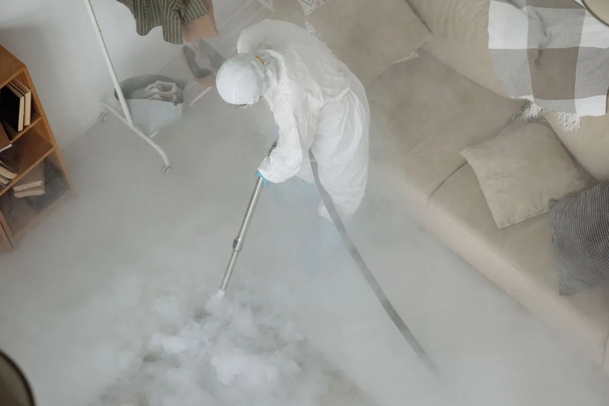 Biohazard cleanup technician in protective equipment, Bellevue, PA